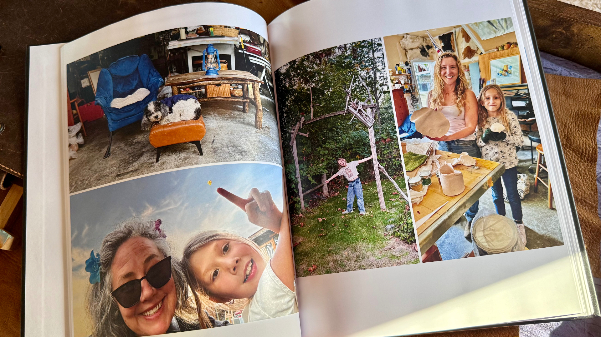 An open album spread with a dog resting on an ottoman beside a blue armchair, a selfie pointing at the sky, a girl stretching in the yard by a trellis, and two smiling makers holding pots at the studio table